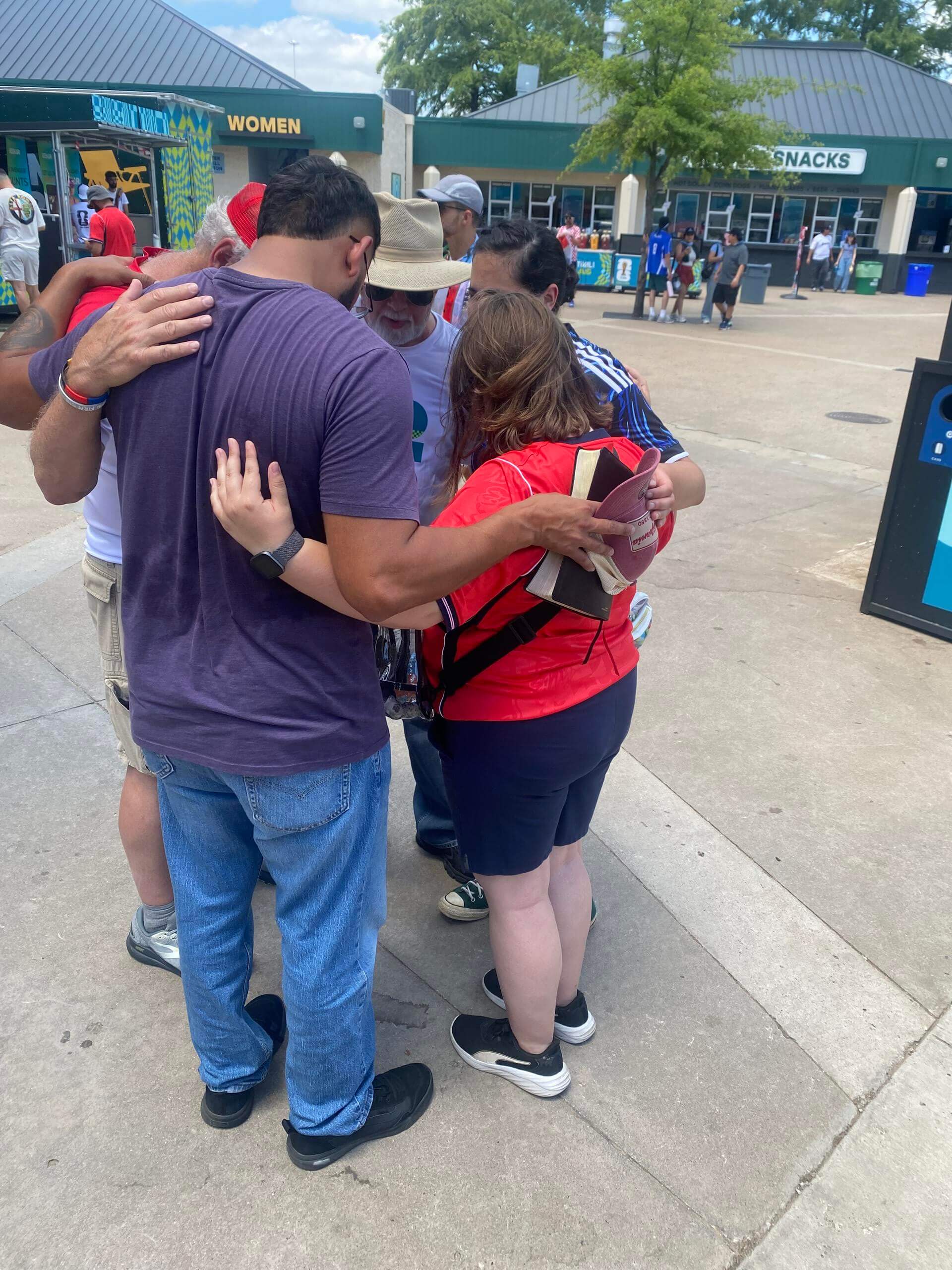 A group praying together at a public event