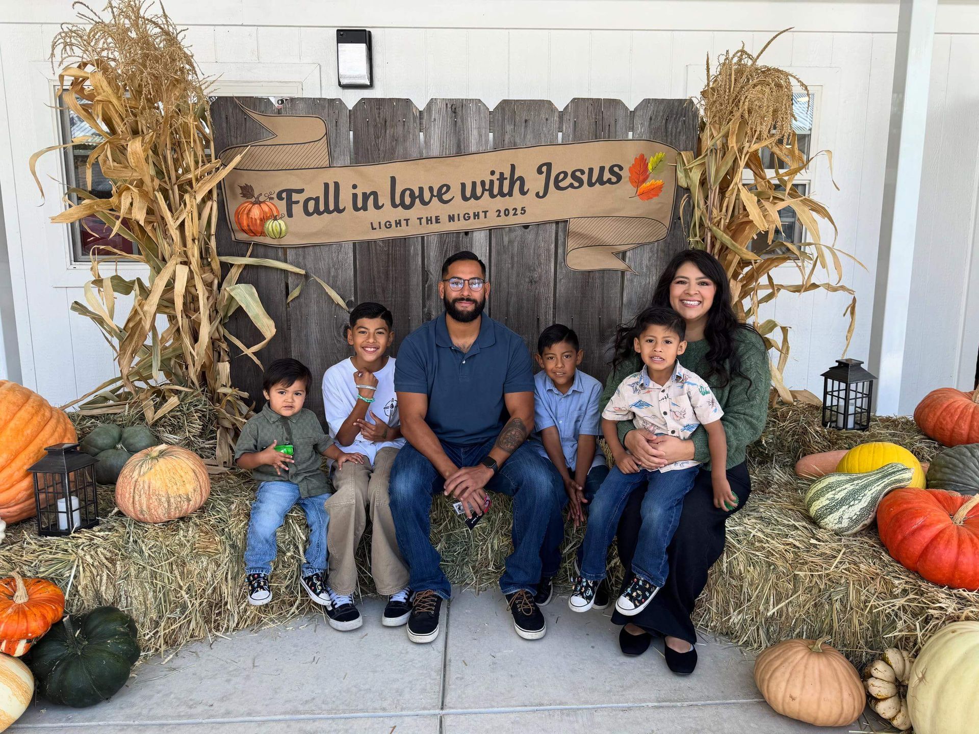 Joshua Maez with his family at an outdoor fall festival